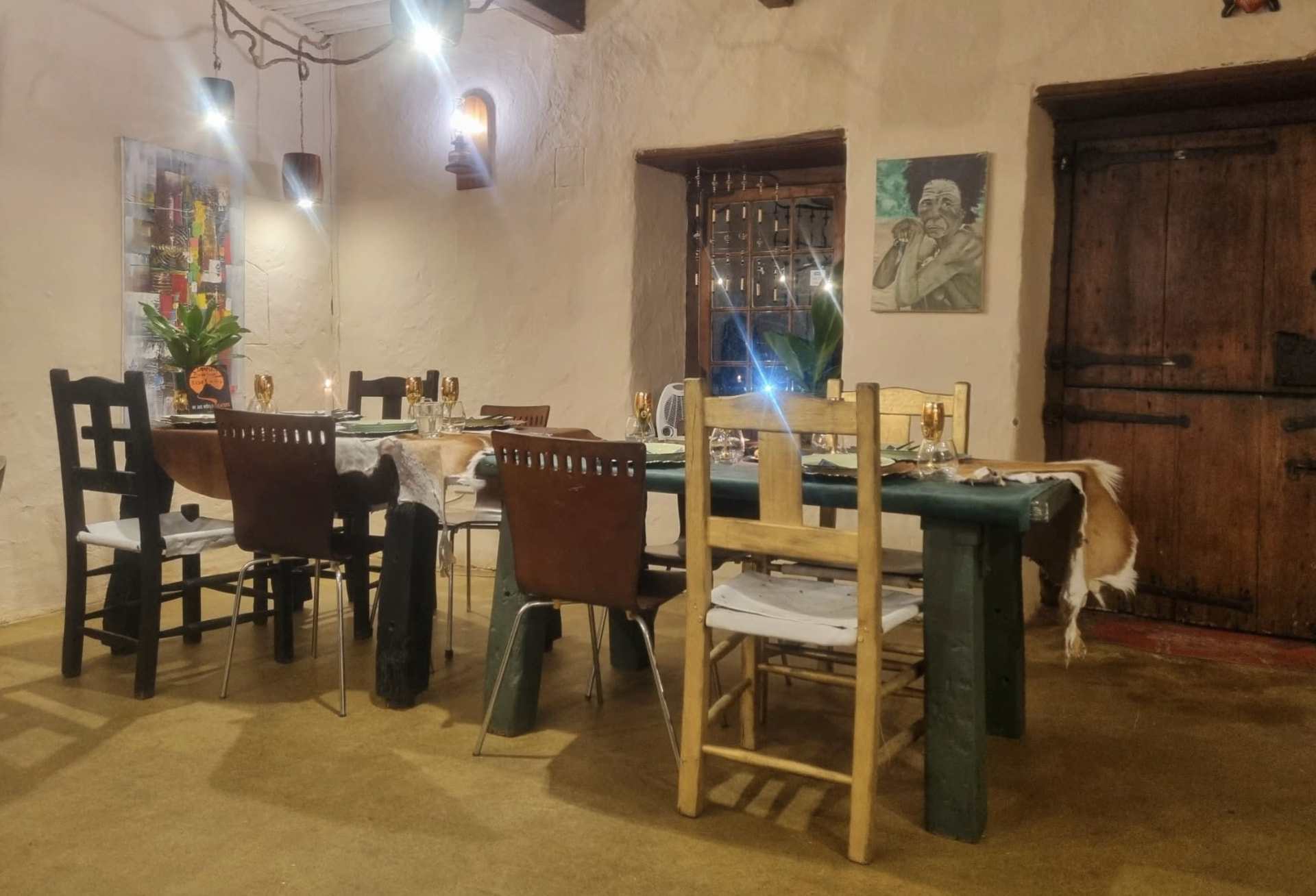 Set dining table with candles and hide runners