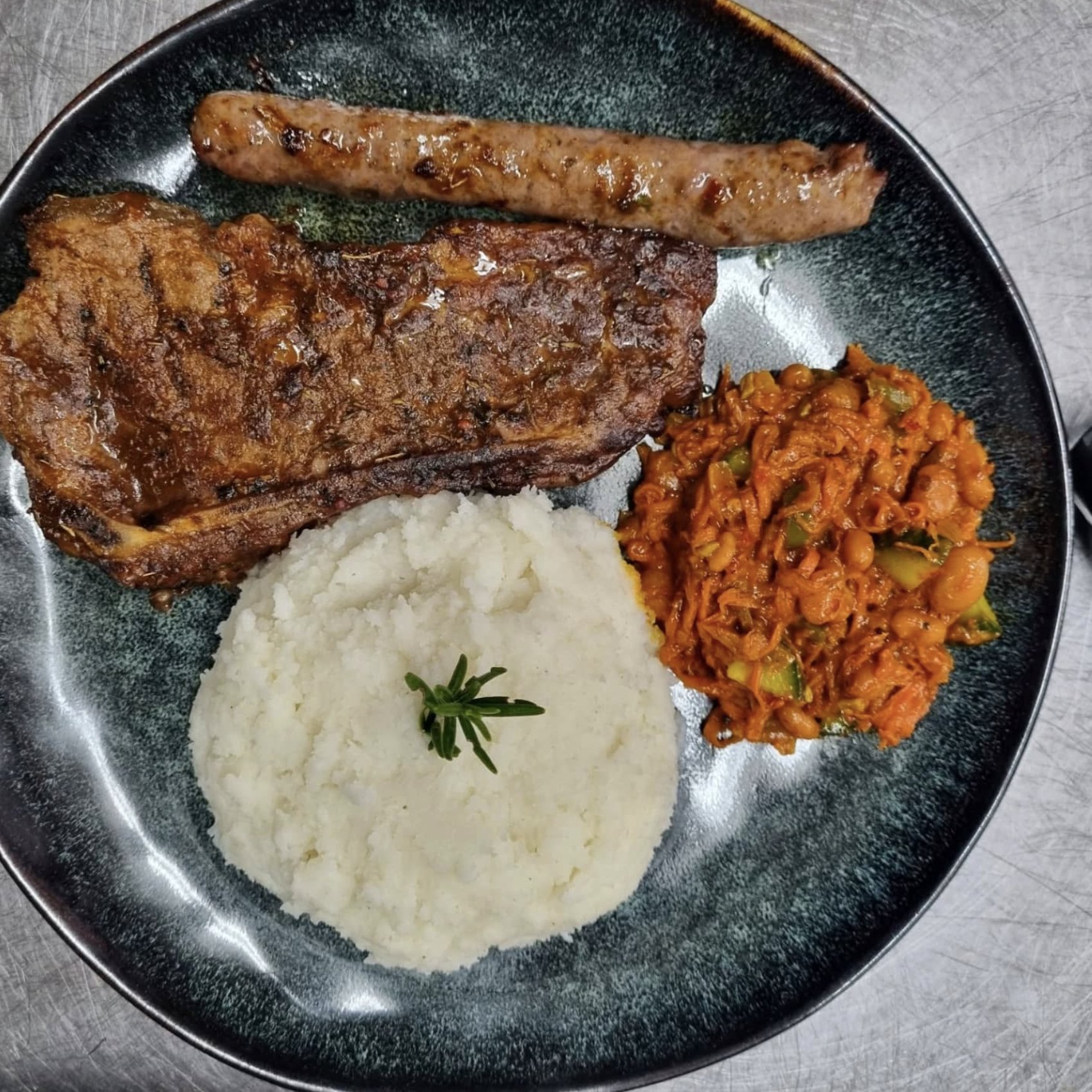 Braai plate with steak, boerewors, pap and chakalaka